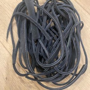 Black leather stripes vary in length